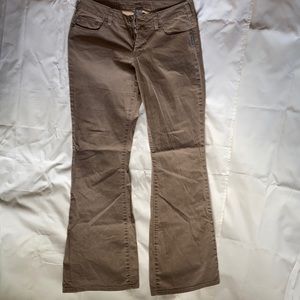 Low waisted silver jeans that are the color tan/brown with some flare